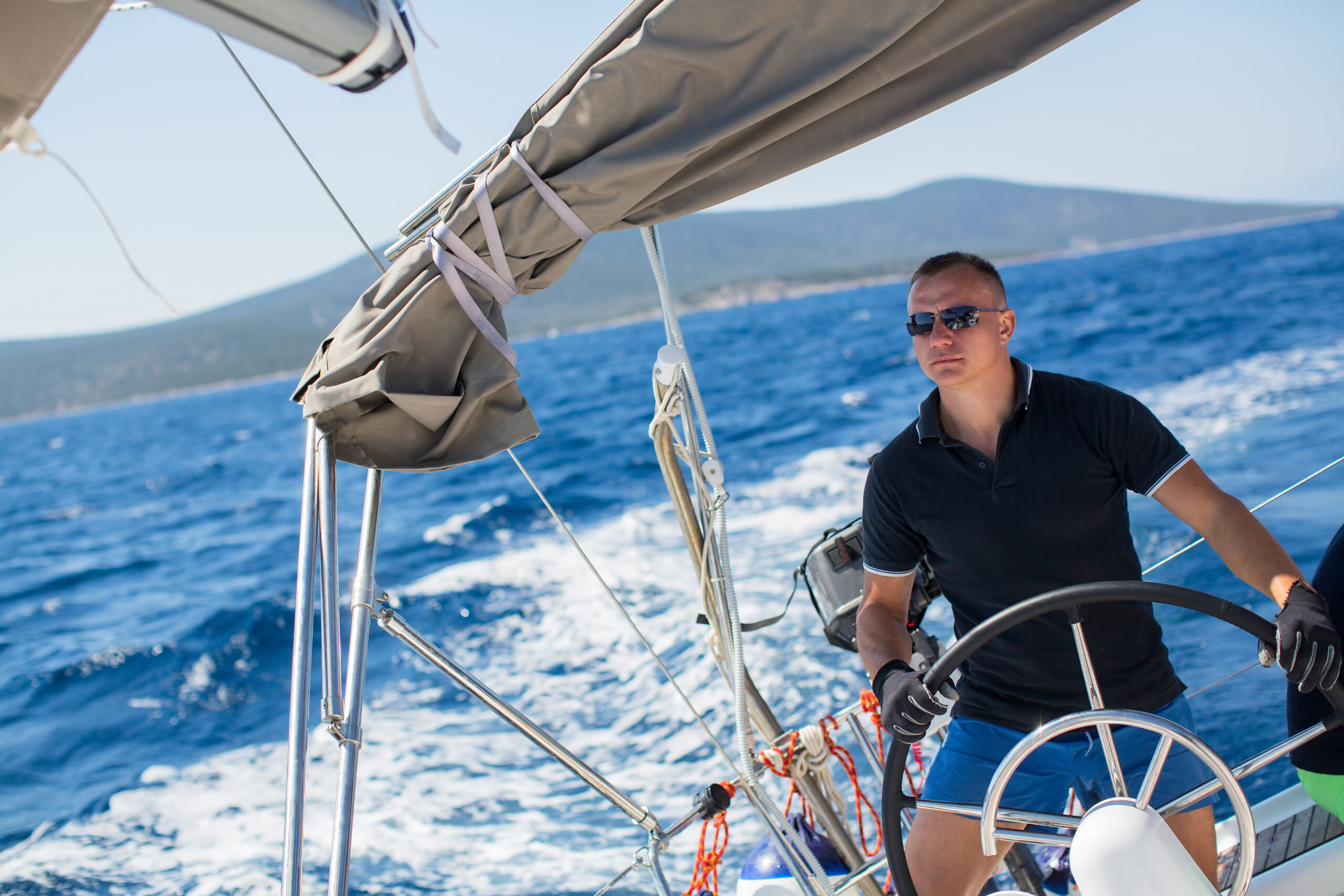 Young,Sailor,Skipper,Manages,Sailing,Vessel,During,Regatta,Race,In